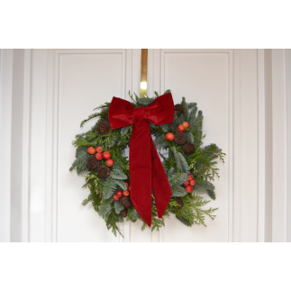 Corona de puerta lazada roja