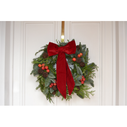 Corona de puerta lazada roja