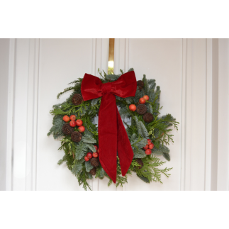 Corona de puerta lazada roja