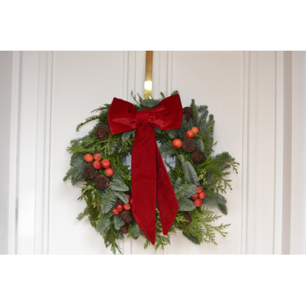 Corona de puerta lazada roja