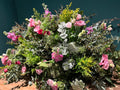 Cojín funerario en colores rosados