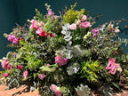 Cojín funerario en colores rosados